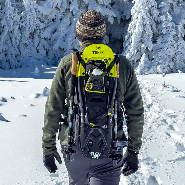 Packable hiking backpack with gear attachments for hiking poles and snowshoes.