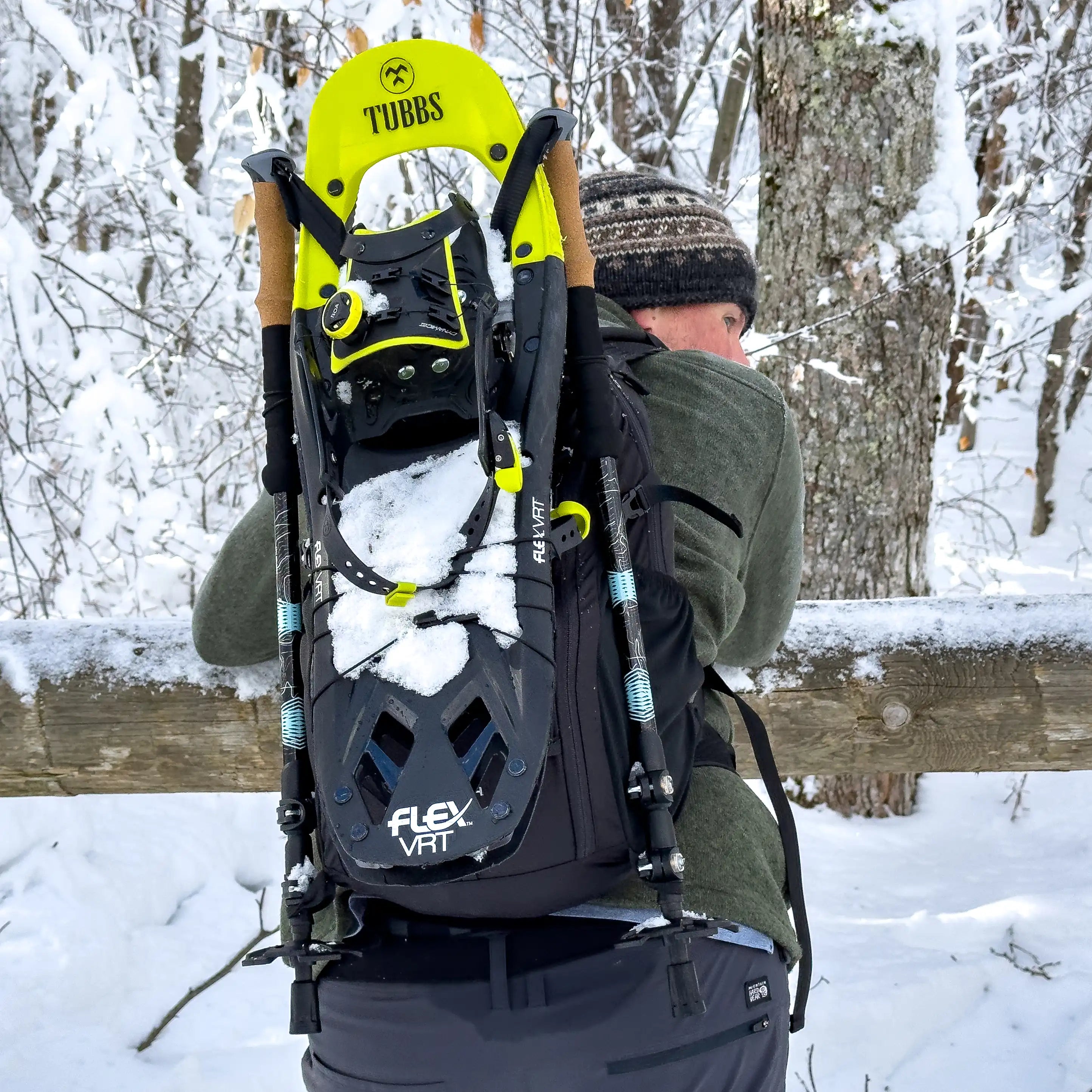 Packable hiking backpack with gear attachments for hiking poles and snowshoes.