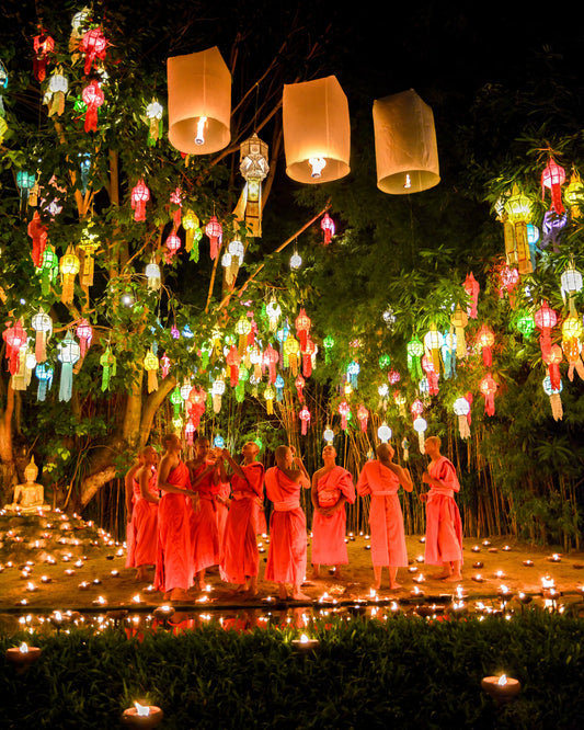 Monks releasing lanterns during the Yi Peng Lantern Festival in Chiang Mai, Thailand.